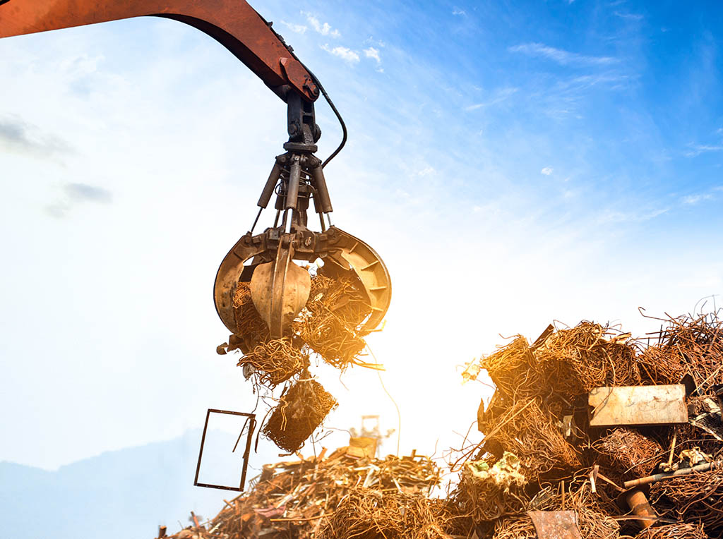 Claw grabbing scrap with sunlight behind